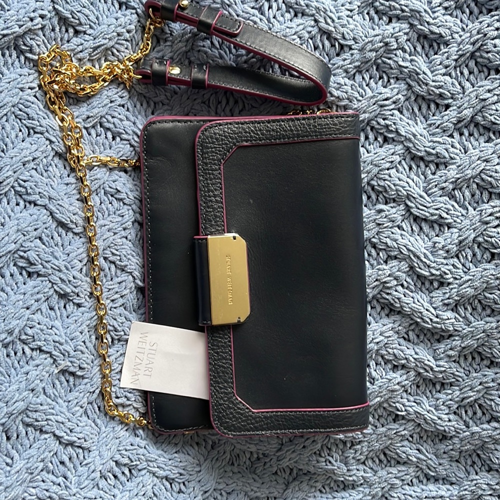 Brand new with tags Stuart Weitzman small pouch with gold link.